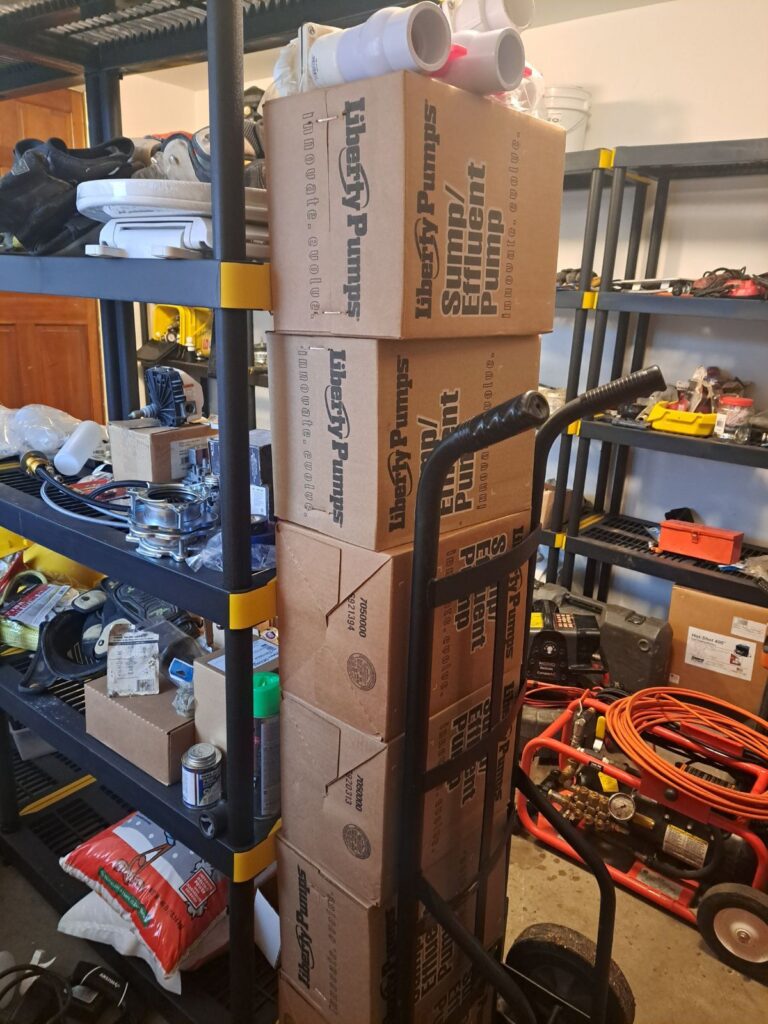 A photo of a stack of sump pumps for installation in Denver